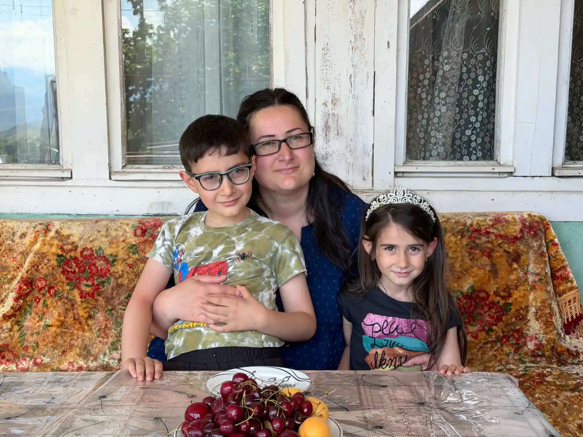 Refugee mother from Artsakh with her two children at home in Armenia - Arev Society life stories